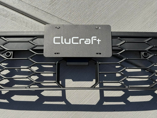 CluCraft no-drill center mount license plate bracket installed on 2025-2026 VW MK8.5 Golf GTI front bumper